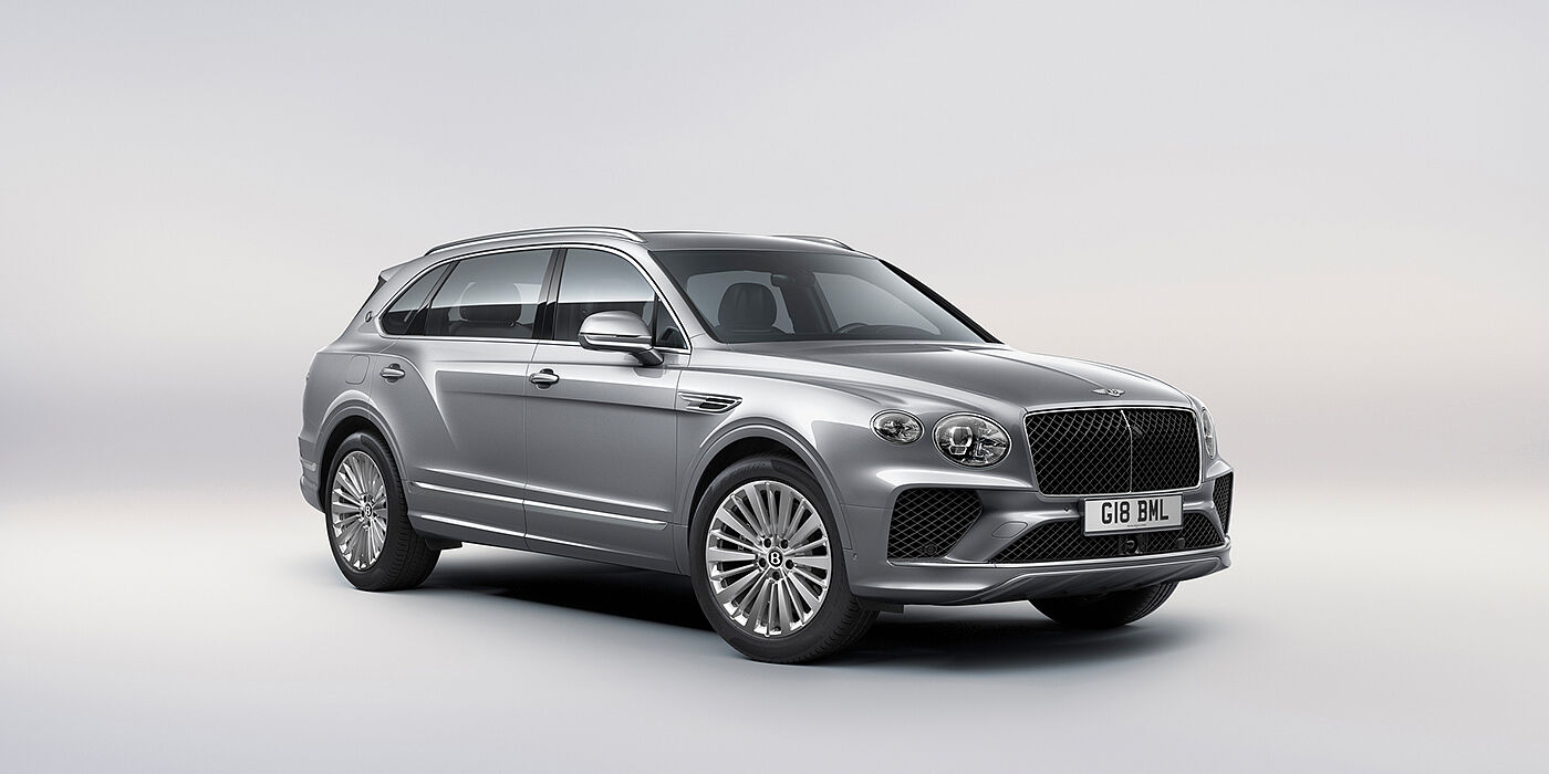 Bentley Almaty Bentley Bentayga Extended Wheelbase luxury SUV front three quarter view in Moonbeam paint with 21 inch five spoke painted wheels