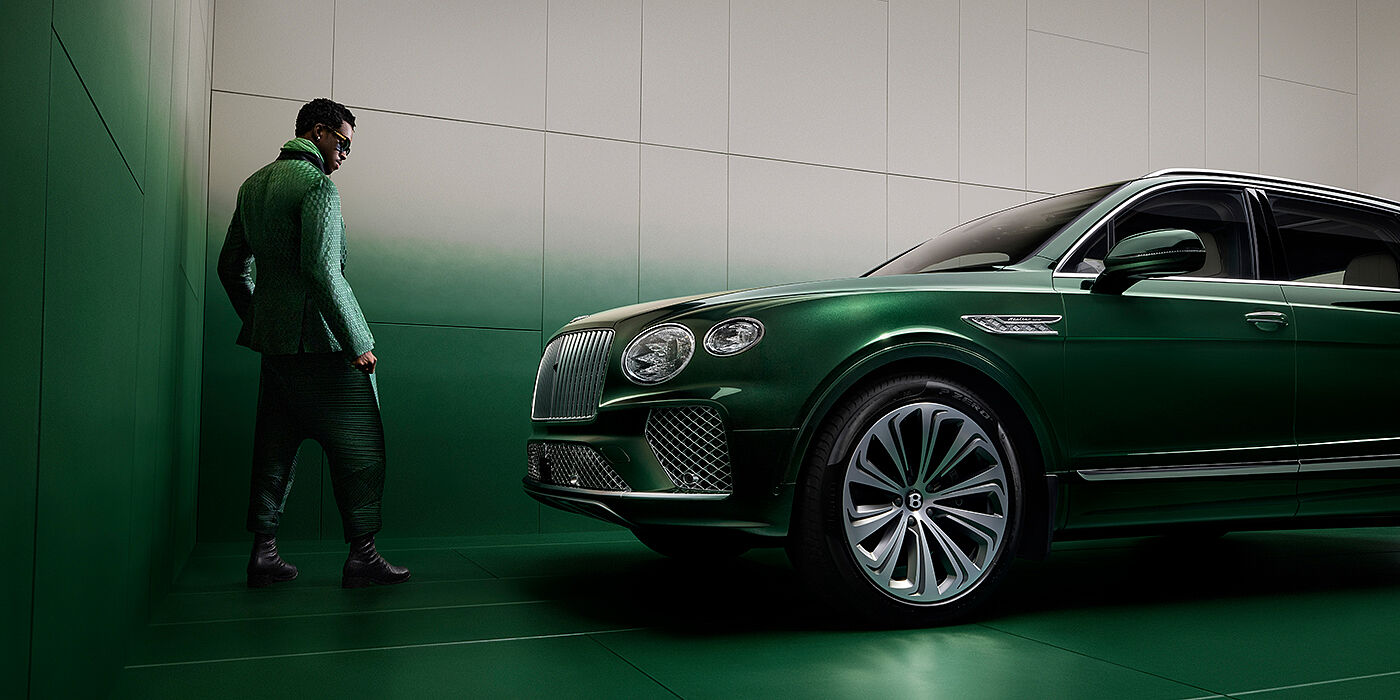 Bentley Almaty Wisdom K standing next to Bentley Bentayga Extended Wheelbase SUV in Light Emerald green paint in profile