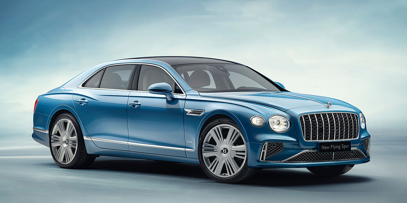 Bentley Almaty New Bentley Flying Spur Azure sedan front view in Light windsor blue by Mulliner paint with 22 inch Azure wheels and chrome exterior details