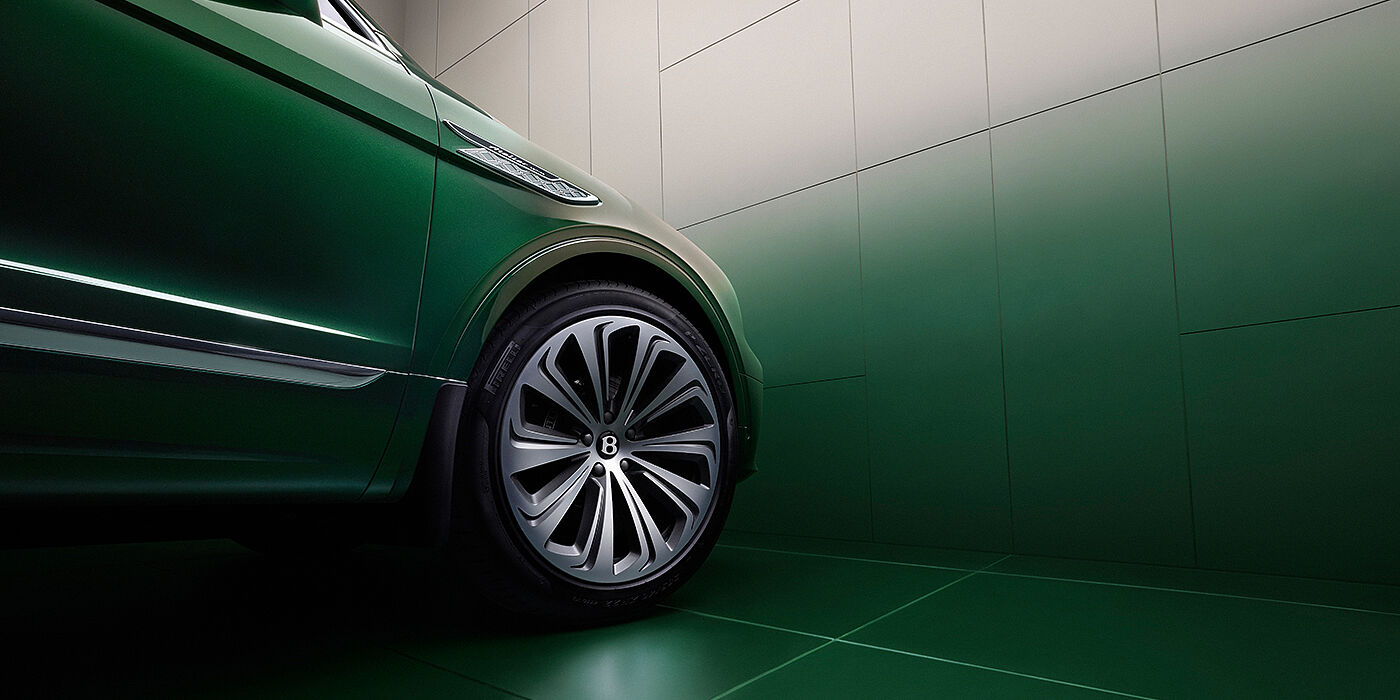 Bentley Almaty Bentley Bentayga Extended Wheelbase Atelier Edition SUV in Light Emerald green paint front side detail with 22 inch 10 spoke wheel