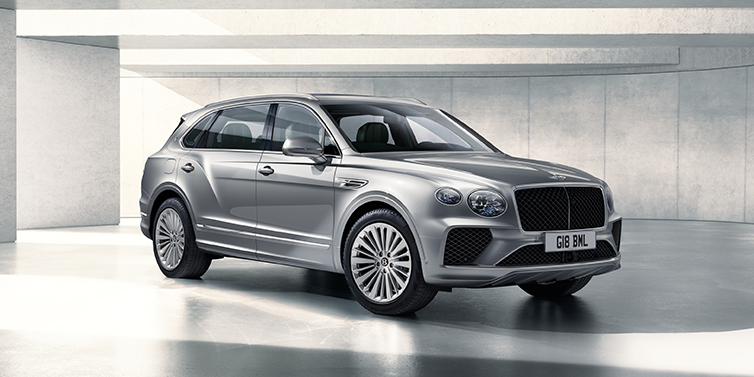 Bentley Almaty Bentley Bentayga Extended Wheelbase SUV front three quarter in Moonbeam paint with a grey background