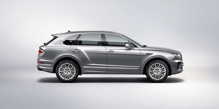 Bentley Almaty Bentley Bentayga SUV side profile in Moonbeam silver paint against white background featuring 21 inch 5 spoke wheels