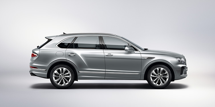Bentley Almaty Bentley Bentayga SUV side profile in Moonbeam silver paint against white background featuring 21 inch 5 spoke wheels