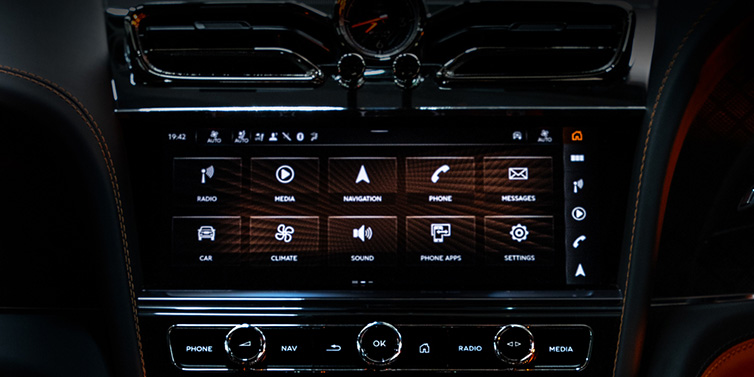 Bentley Almaty Bentley Bentayga S Black Edition SUV front interior console with MMI screen featuring driver options surrounded by dark hide