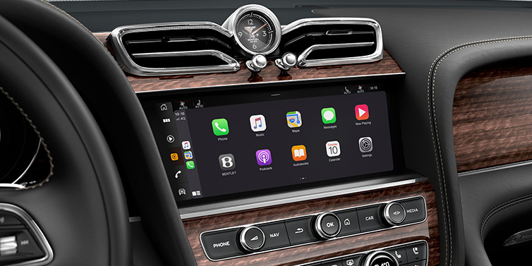 Bentley Almaty Bentley Bentayga Extended Wheelbase SUV front interior centre console MMI screen showing apps surrounded by Beluga black hide and Crown Cut Walnut veneer