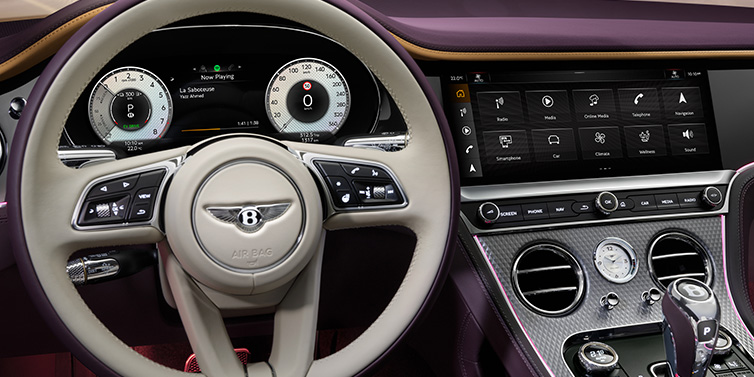 Bentley Almaty Bentley Continental GTC Mulliner convertible steering wheel and drivers screens surrounded by Damson purple and Linen hides